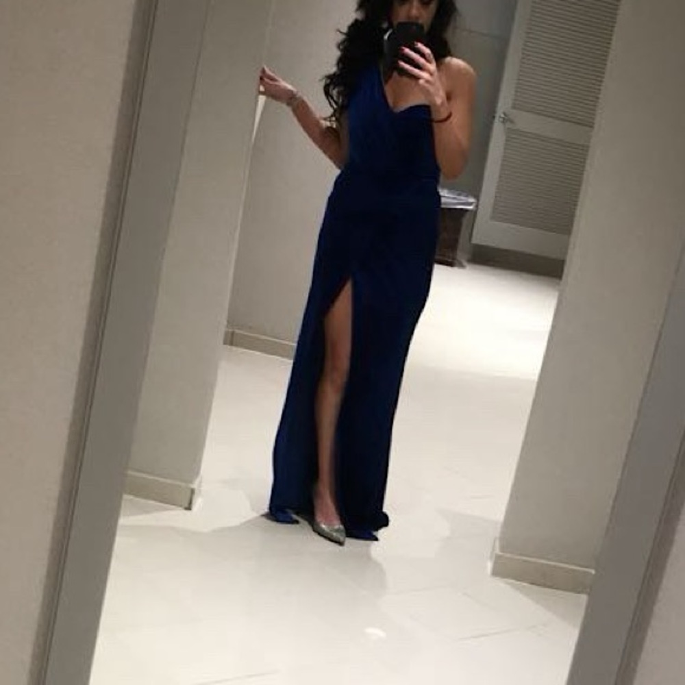One shoulder, floor length, velvet dress with thigh high leg slit.